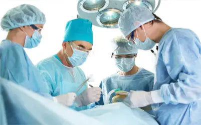 Medical team conducts precise procedure in sterile OR, highlighting clinical expertise and safety.