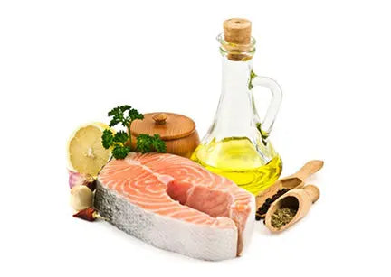 Raw salmon with herbs, lemon, and olive oil—rich sources of healthy fatty acids.