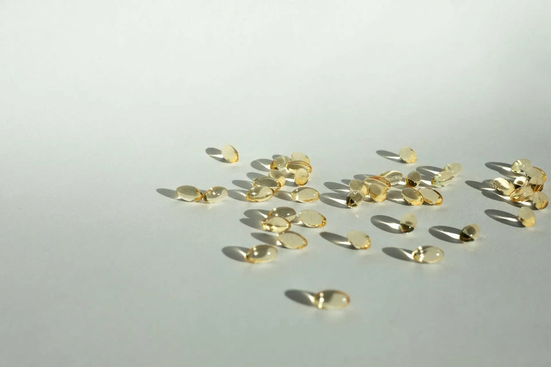 Scattered gold vitamin tablets