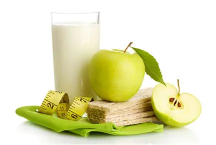 Whole grain crackers, green apple, milk, and measuring tape—symbols of balanced dieting.