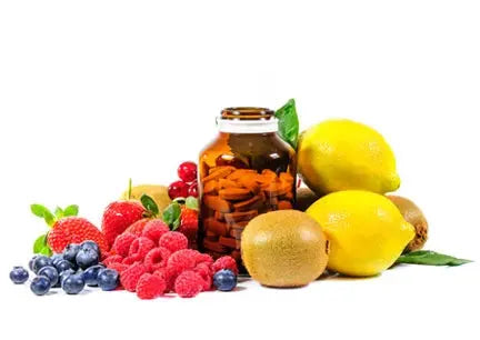 Fruit and supplement bottle symbolizing natural and synthetic multivitamin sources.